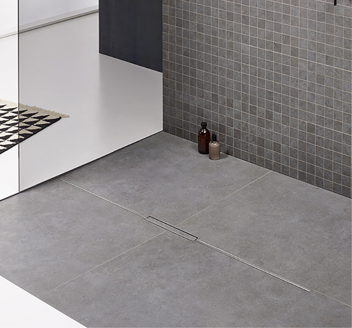 Fliesen in Grau: Duschrinnen wie die Cera-Floor Individual von Dallmer in Edelstahl matt fügen sich harmonisch in das Gesamtbild ein.