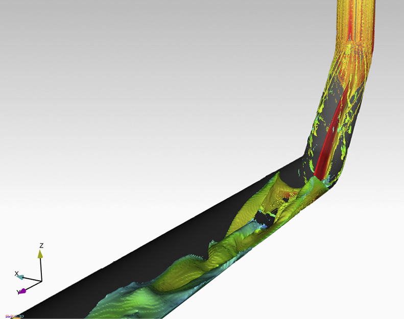 Computergestützte Simulation über das Strömungsverhalten des Abwassers im Umlenkungsbereich einer Abwasserleitung.