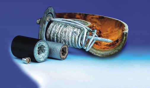 Bild 1 Durch Kalkablagerungen beeinträchtigte Rohrleitungen und Bauteile