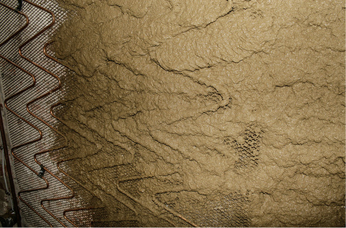 



Erste Putzschicht (Lehmputz) auf ein Wandheizungssystem in Nassbauweise.
