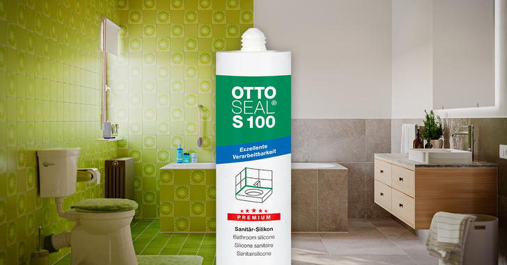 Eine Tube OTTOSEAL S100 Silikon steht in einem retro-grün gefliesten und modern-beigen Badezimmer. - © OTTO-CHEMIE