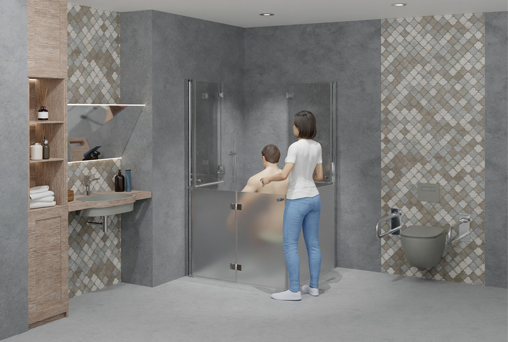  Komfortabel geteilt: Wenn lediglich die unteren ­Hälften der Duschkabine geschlossen sind, bilden die Drehfalttüren einen komfortablen Spritzschutz für die assistierende Person.