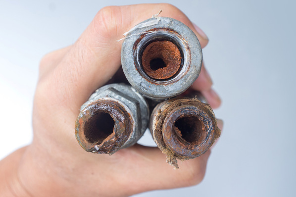 Embolism: A pipe clogged with sediment rust. With copy space.